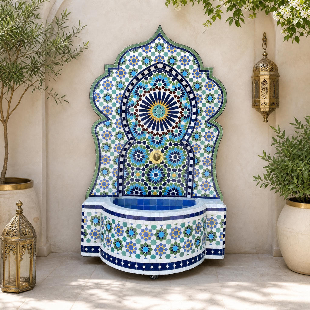 a decorative fountain with a mosaic design, surrounded by potted plants and a lantern, creating an elegant and inviting outdoor space.
