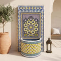 a decorative mosaic fountain with a blue and yellow pattern, placed in a room with a potted plant and a lantern.