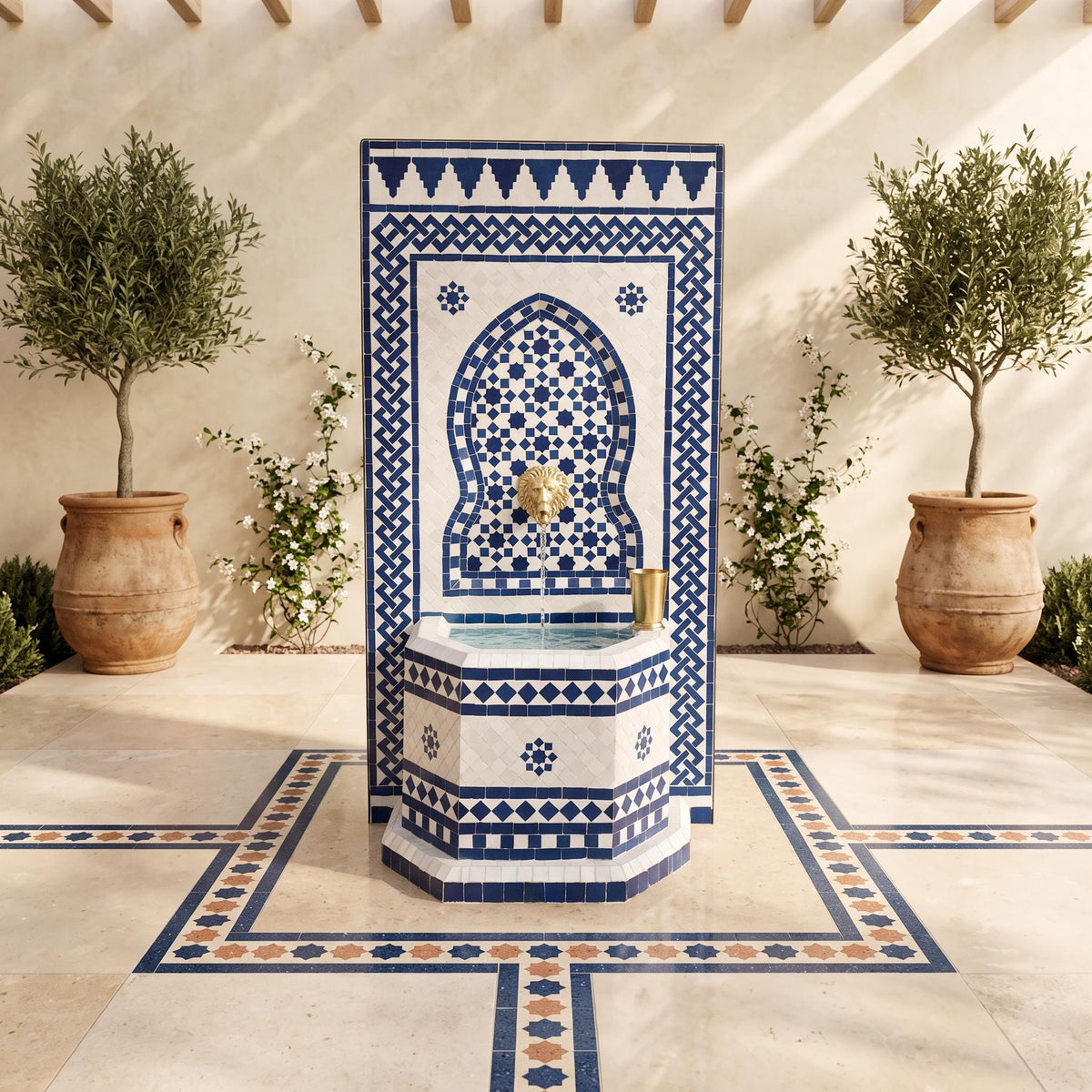 a decorative fountain with a blue and white tile design, surrounded by potted plants and a tiled floor.