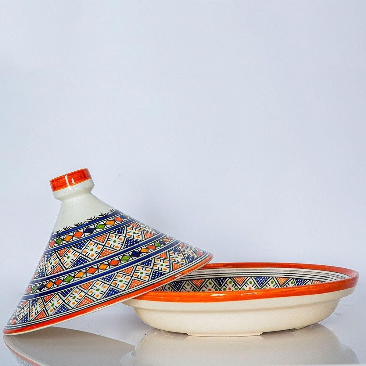 a decorative ceramic bowl with a colorful, patterned lid.