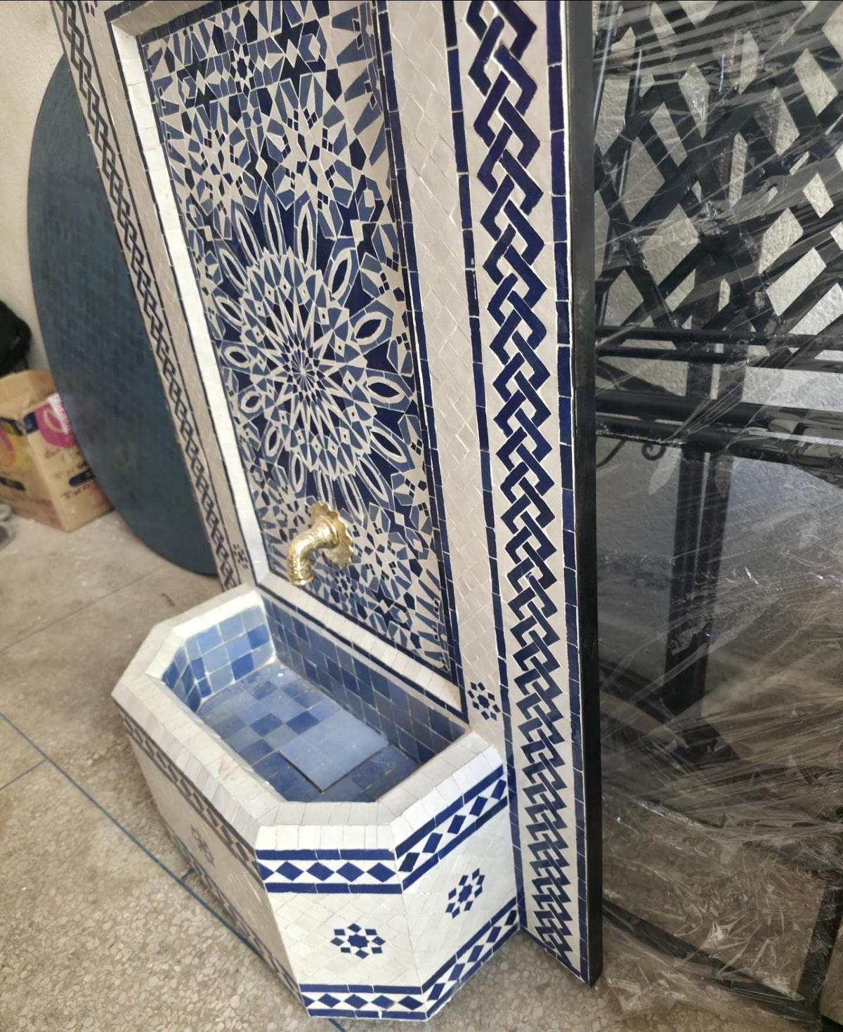 Moroccan mosaic wall fountain shown with dimensions, measuring 110 by 70 by 25 cm (43 by 27.5 by 10 in), a large statement water feature for indoor or outdoor spaces.