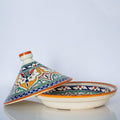 a decorative ceramic bowl with a colorful, patterned lid.