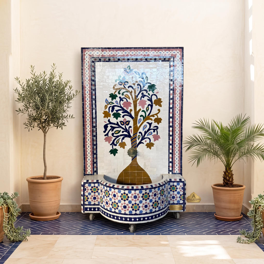 a decorative fountain with a tree design, surrounded by potted plants and a blue and white tiled wall.