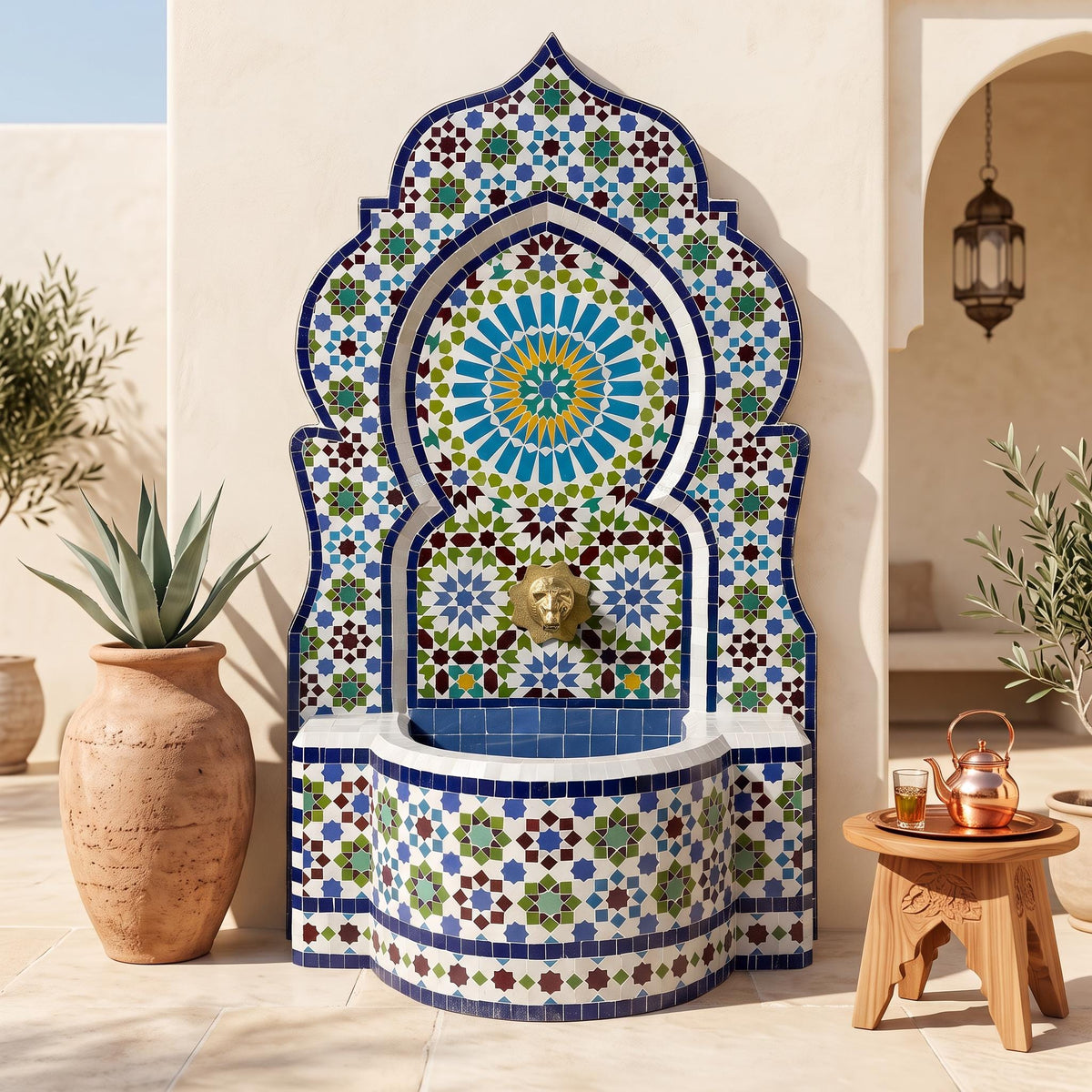 a decorative fountain with a mosaic design, surrounded by potted plants and a wooden table.
