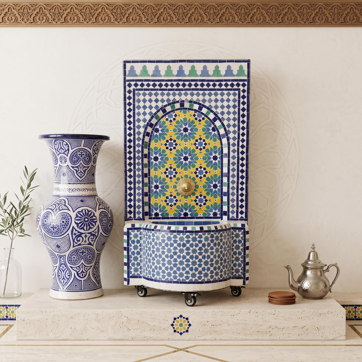 a decorative tile wall with a blue and white vase, a metal teapot, and a decorative tile fountain.