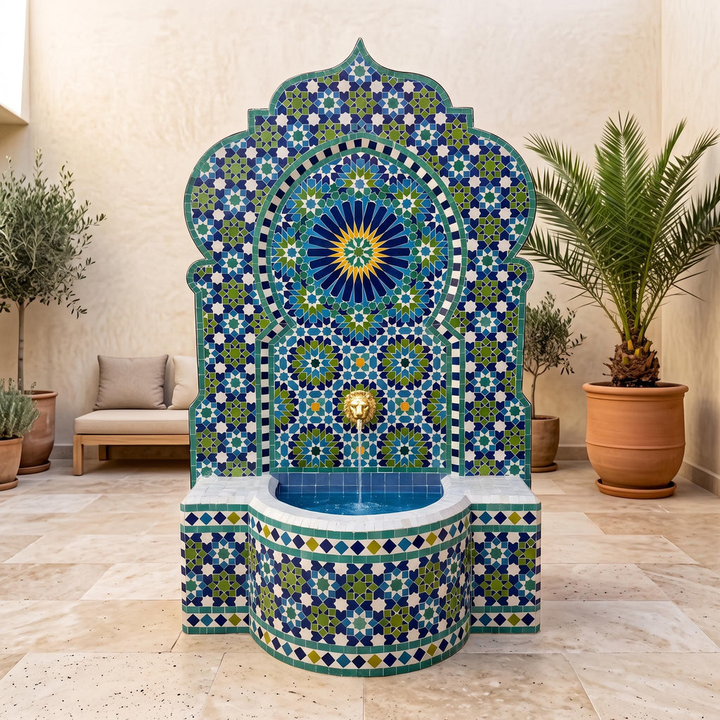 a decorative fountain with a mosaic design in blue, green, and yellow colors, situated in a room with a beige wall and potted plants.