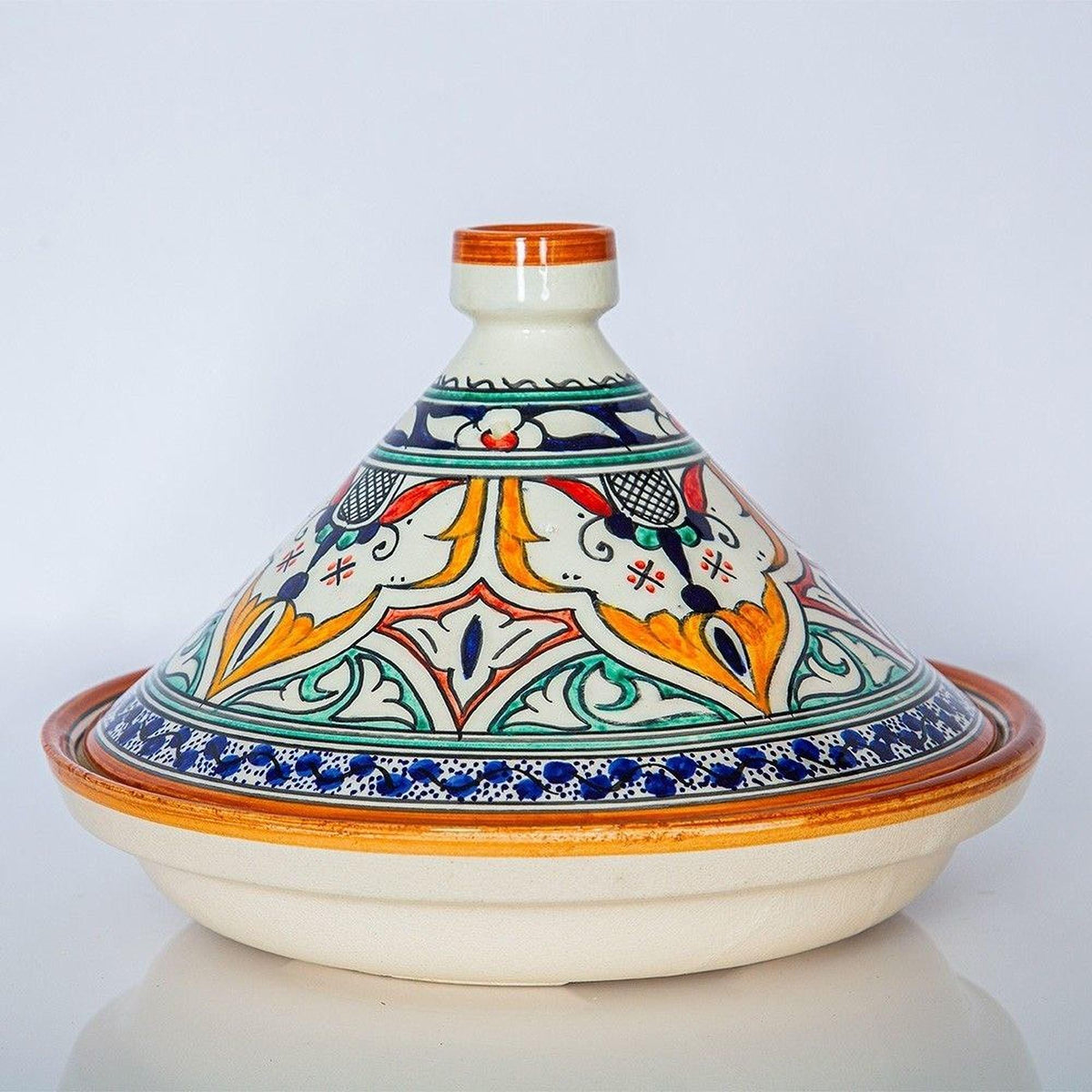 A colorful ceramic bowl with a decorative pattern on its surface, placed on a white background.
